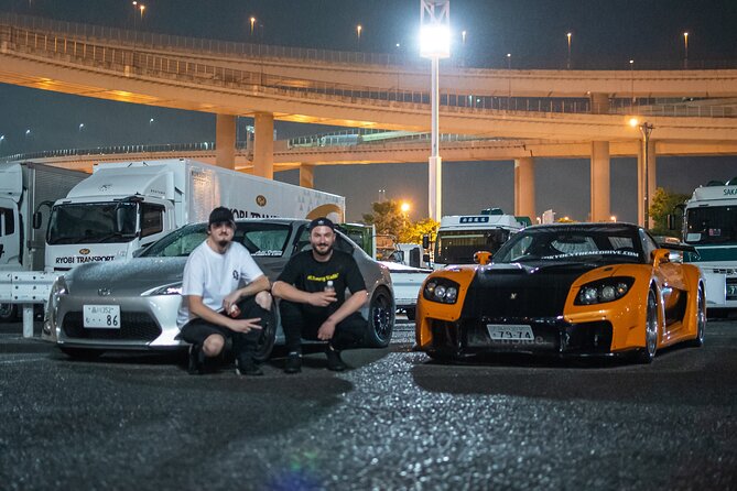 Veilside Mazda RX-7 and Toyota 86 with their drivers at a Daikoku PA night meet